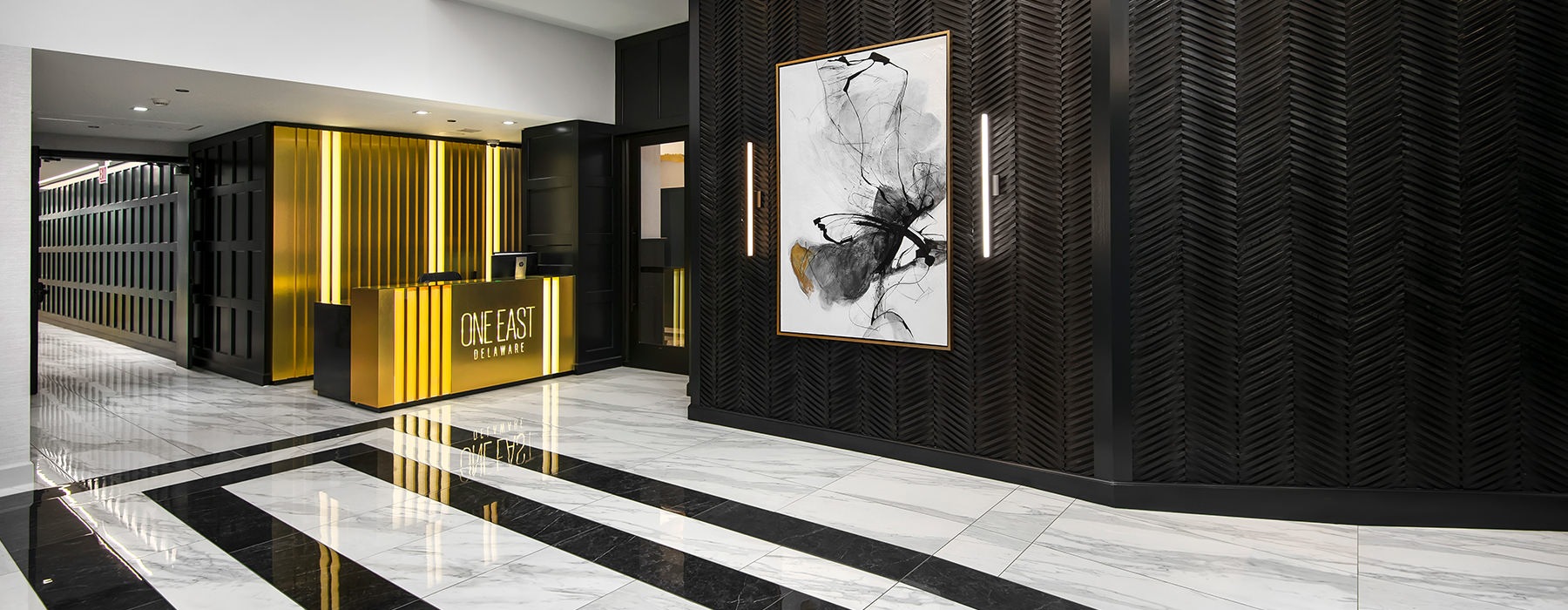 Spacious lobby with gold desk 