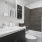 Large well lit bathroom with white accents 
