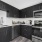 Spacious and well lit kitchen with wood flooring and stainless steel appliances